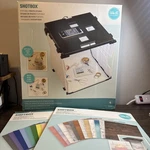 We Memory Keepers Shotbox With 2 Packs Of Background. Fixed Price $99.99.