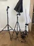 Emart Photo Studio Light Stands With Carrying Bag. Three W/two Umbrellas. Fixed Price $35.00.