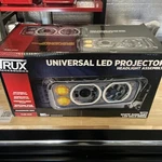Trux TLED-H121 Passenger Side Projection Headlight W/ Auxiliary Halo Rings. Fixed Price $343.99.